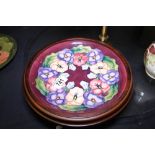 Moorcroft Pansy wall plaque in wooden surround