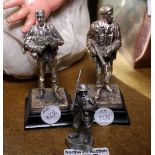 Three cast metal military figures