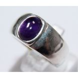 Sterling silver heavy set ring with purple cabachon stone, size O