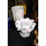 Two florally decorated vases and rose holder