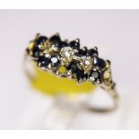 CLUSTER RING. 9ct gold sapphire and diamond cluster ring