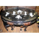 CHINESE TABLE. Chinese oval black lacquered table with mother of pearl decoration and six