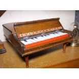 TOY PIANO. Oak cased vintage toy piano