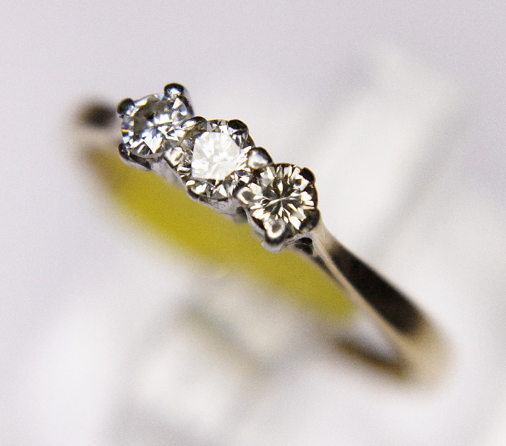 DIAMOND RING. 18ct gold and platinum vintage 1950s three stone diamond ring, size L/M