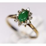GOLD DIAMOND RING. 9ct yellow gold diamond and pear cut emerald set ring, size L
