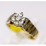 DAISY CLUSTER RING. 18ct gold vintage 1975 seven stone diamond daisy cluster ring, size M