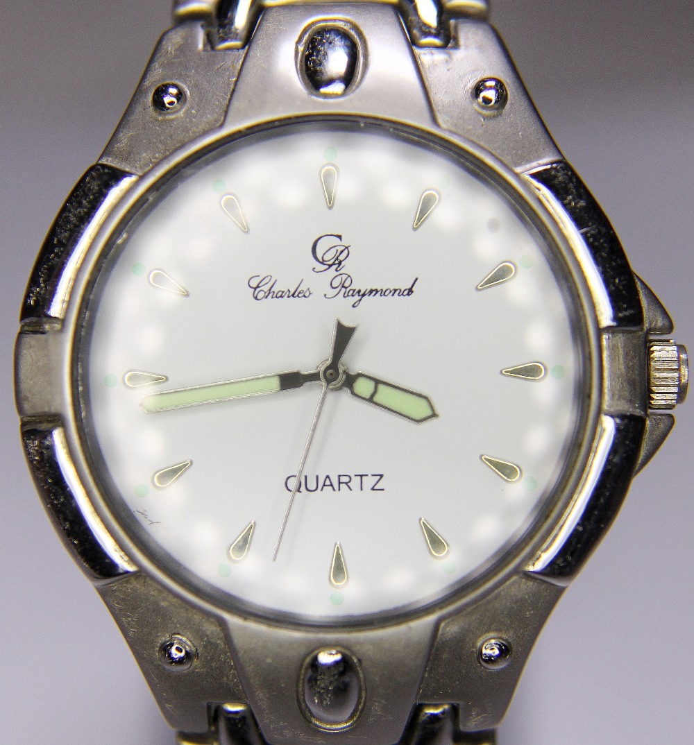 CHARLES RAYMOND WRISTWATCH. Charles Raymond white faced stainless steel wristwatch and strap