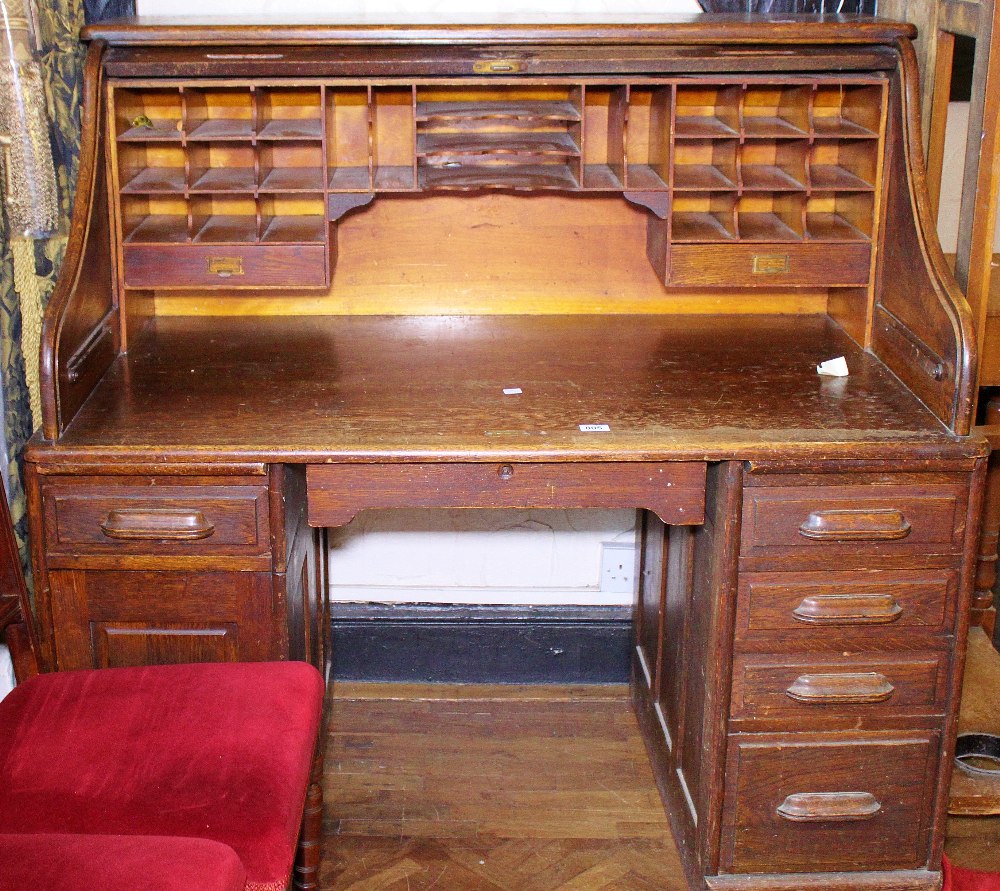 ROLLTOP DESK. Oak rolltop desk with fitted interior and swinging lower left hand drawer section