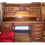 ROLLTOP DESK. Oak rolltop desk with fitted interior and swinging lower left hand drawer section