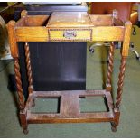 OAK STICK STAND. Antique oak hallway stick stand on barleytwist supports legs with glove box. H -