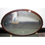 MAHOGANY MIRROR. Mahogany framed oval bevel edged mirror