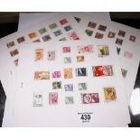 CHINESE STAMPS. Three sheets of franked Chinese postage stamps