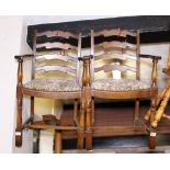 LADDERBACK CHAIRS. Pair of oak ladderback carvers