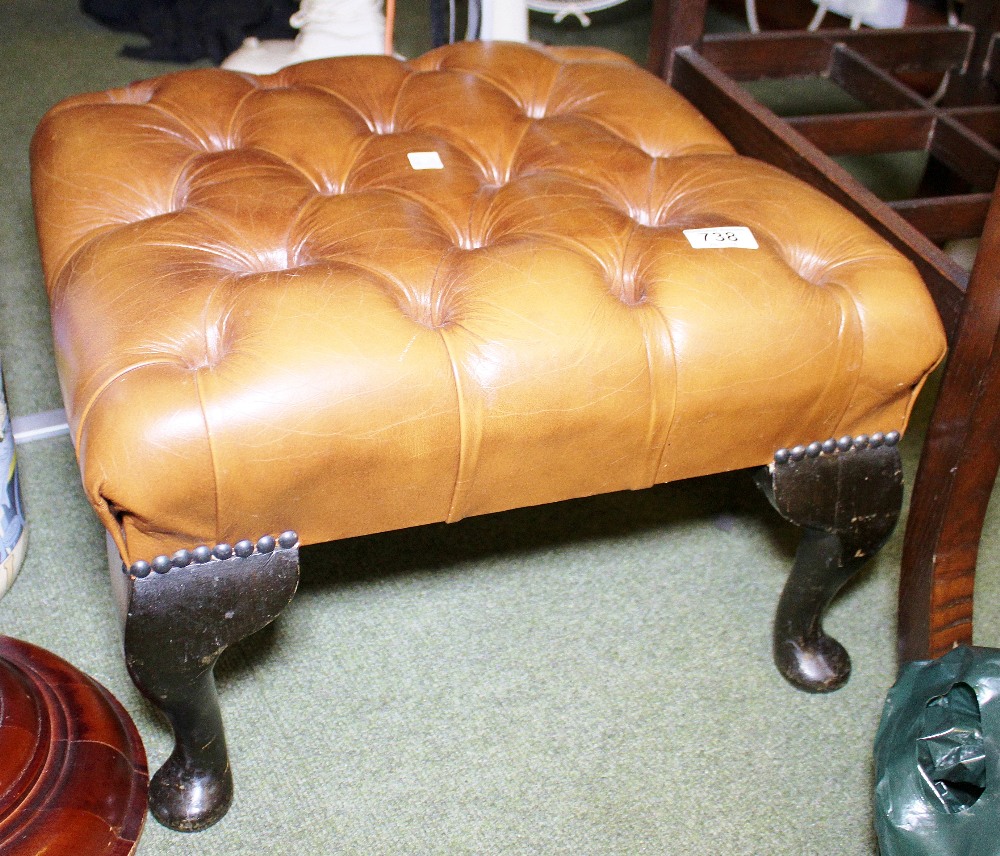 LEATHER FOOTSTOOL. Chesterfield style brown leather buttoned foot stool