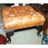 LEATHER FOOTSTOOL. Chesterfield style brown leather buttoned foot stool