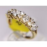 ETERNITY RING. 18ct gold half eternity ring, size J