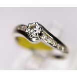DIMAOND SOLITAIRE. 9ct white gold diamond solitaire with diamond shoulders, size O