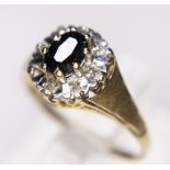 GARNET AND DIAMOND RING. 9ct yellow gold garnet and diamond set ring, size M