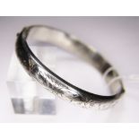 SILVER BANGLE. Sterling silver hollow engraved vintage 1958 bangle, hallmarked Chester