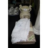 Cast resin water light feature and quantity of linen and lace