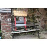 Cast iron ended garden bench, garden tools and a Workmate