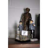 Laurel and Hardy ceramic models and a paperweight