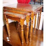 Mahogany nest of three tables with brown leather and glass tops