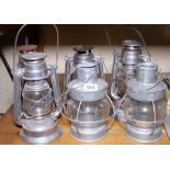 Six retro style aluminium and glass hurricane lamps