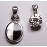 Two sterling silver pendants, one CZ and one onyx and mother of pearl