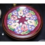 Moorcroft Pansy wall plaque in wooden surround