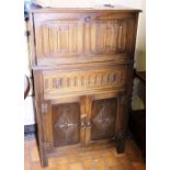 Priory style oak cocktail cabinet with linenfold decoration