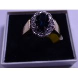 18ct gold thick set sapphire and diamond cluster ring, sapphire 1.2ct, size Q/R