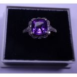 9ct white gold amethyst solitaire with diamond set mount, size K