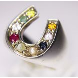HORSESHOE RING. Sterling silver horseshoe ring set with set with precious and semi precious