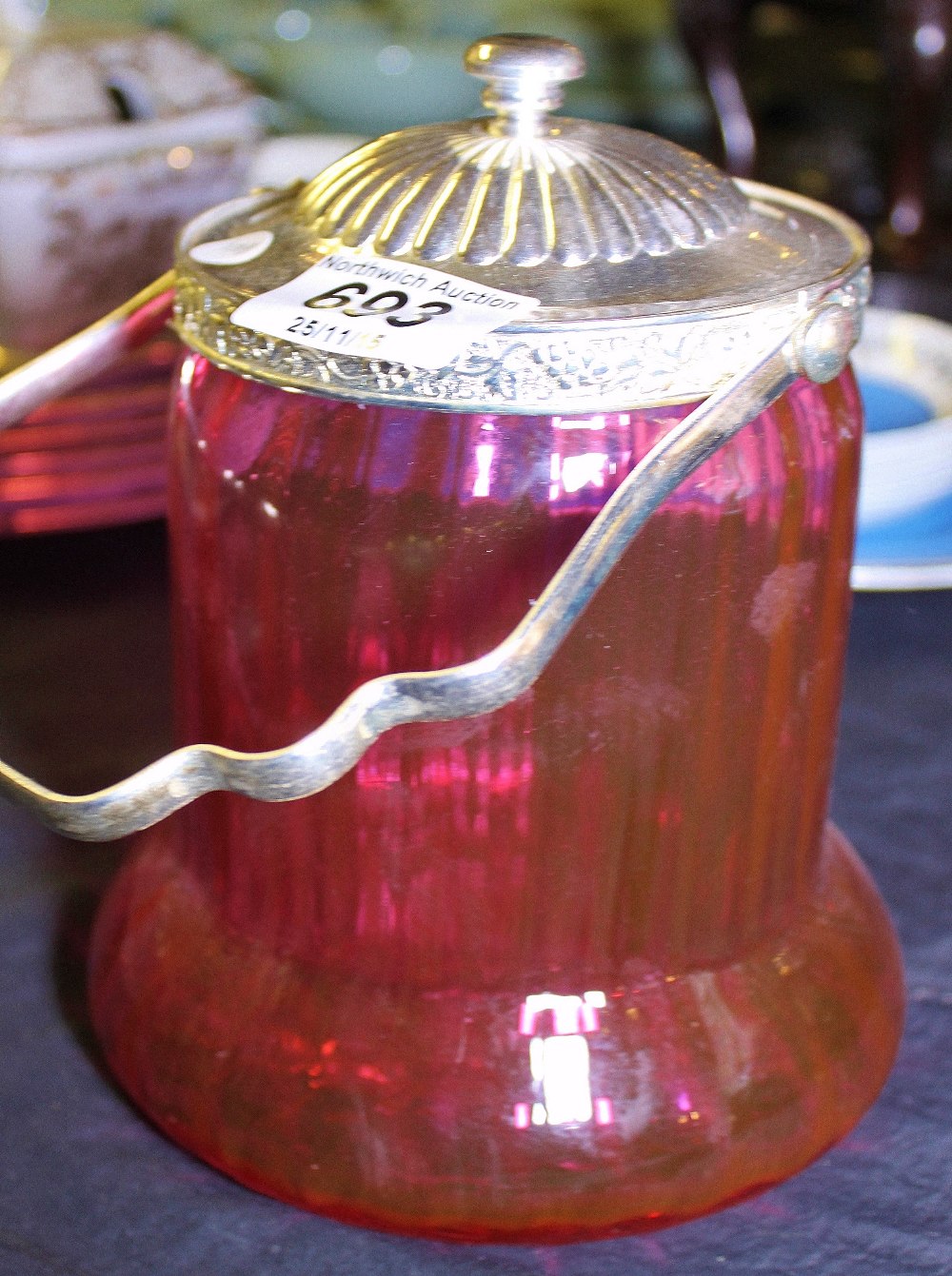 CRANBERRY GLASS BISCUIT BARREL. Cranberry glass biscuit barrel with silver plated lid and handle