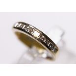 9CT GOLD PRINCESS CUT RING. 9ct gold princess cut channel set diamond half eternity ring, size L