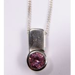 SILVER STONE SET PENDANT. Sterling silver pink stone set pendant on sterling silver curb necklace