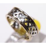 9CT GOLD CELTIC BAND. 9ct yellow and white gold Celtic band, size L/M