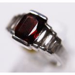 SILVER GARNET BAGUETTE RING. Sterling silver emerald cut garnet and CZ baguette  ring, size P