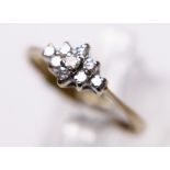 9CT GOLD DIAMOND CLUSTER RING. 9ct gold eight stone diamond cluster ring, size M/N