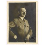 Hitler, Adolf. Eigenhändige Unterschrift auf einer original-photographischen Porträt-Postkarte (Foto