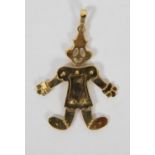 Pendentif en or jaune 18 K ajouré, représentant un clown articulé.Poids brut 9,7 g