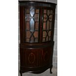 BOW FRONT DISPLAY CABINET - A large bow