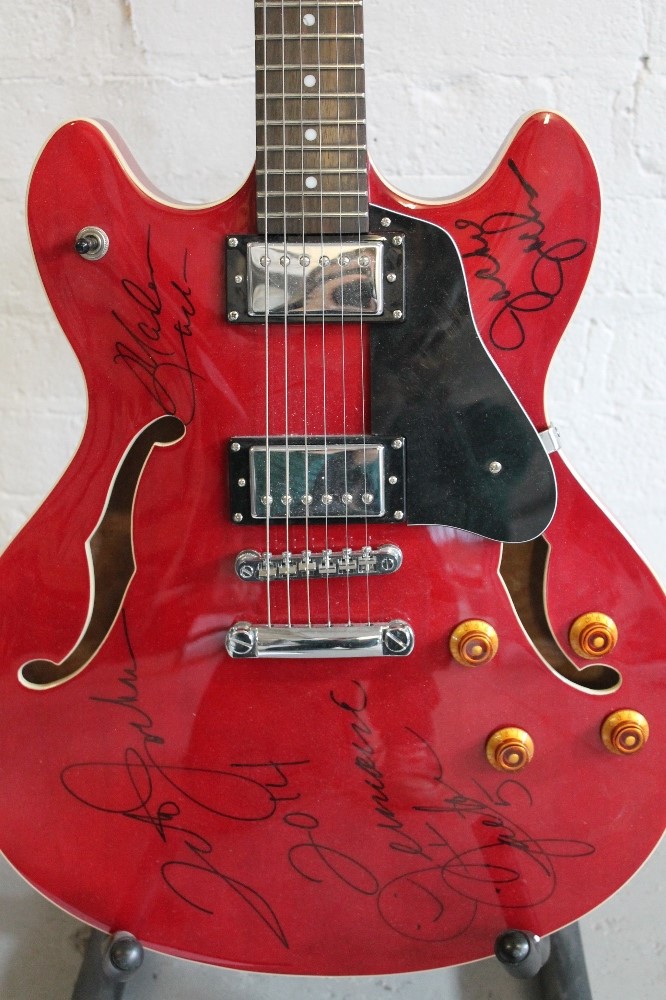 THE JACKSONS - a Rally cherry red electric guitar (in the style of a Gibson ES 335) signed by four - Image 5 of 8