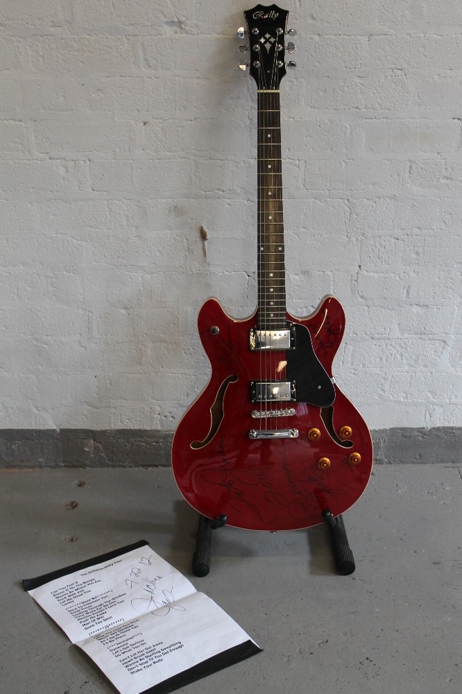THE JACKSONS - a Rally cherry red electric guitar (in the style of a Gibson ES 335) signed by four