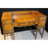 DESK - a late 50s wooden desk featuring five drawers of various sizes with subtle detail to edging.