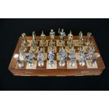 CHESS - a wooden chess board with sets of chess pieces x2,