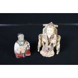 IVORY CARVED FIGURE - A C20th Chinese ivory carved figure of an Emperor seated on a Dragon throne (