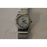 LADIES OMEGA WATCH - an Omega Constellation 6563/875 ladies bi-metal gold and stainless steel wrist