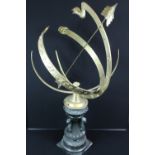 ARMILLARY SUNDIAL - a reproduction armillary sundial featuring the sun,